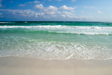 Turquoise waters flowing over the shore
