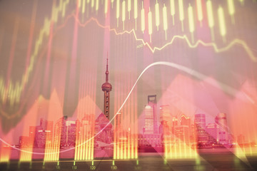 Forex chart on cityscape with tall buildings background multi exposure. Financial research concept.