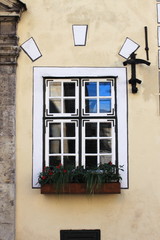 Medieval window with colourful pots