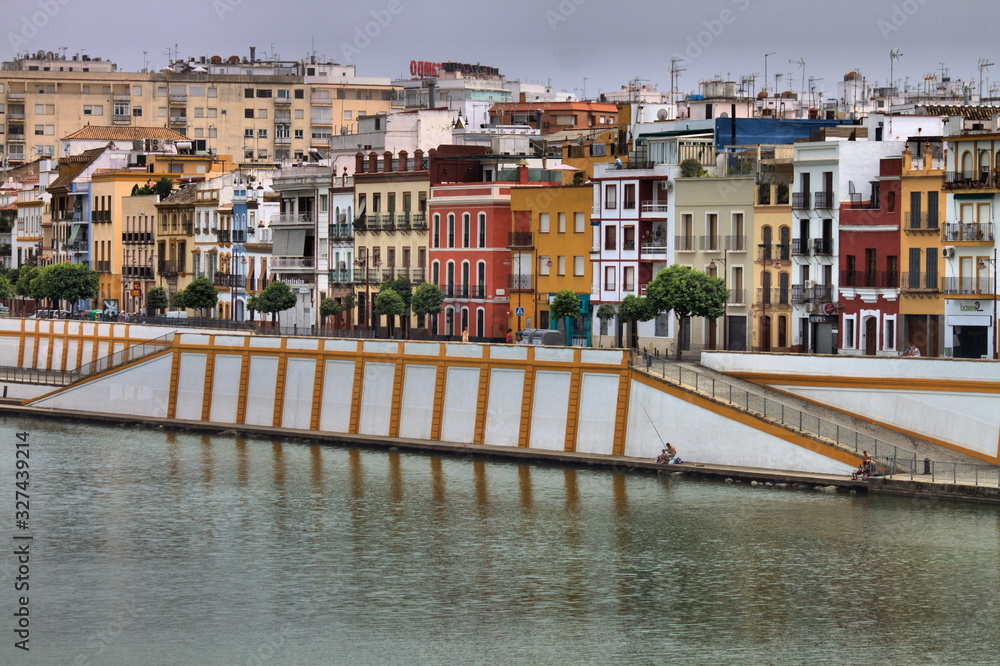 Wall mural cityscape of sevilla along the guadalquivir river, spain