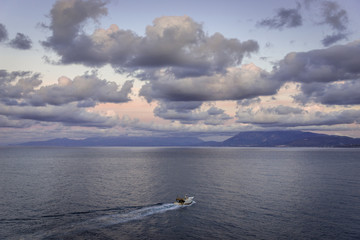 Fishery boat on the Tyrrhenian Sea, view from Zafferano headland in Santa Flavia commune on the Sicily Island, Italy