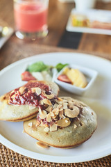 Breakfast table with food i the plate on the wooden table