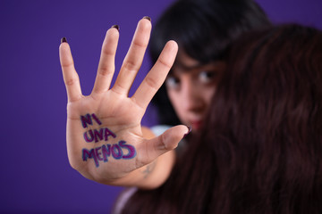 Young hispanic woman campaigning against gender based violence