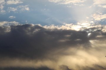 Fototapeta na wymiar Sun through clouds