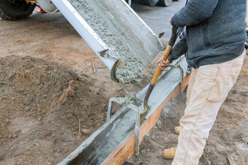Pouring cement during upgrade to residential street