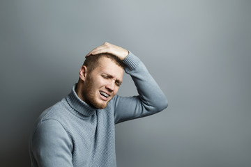 Guy put his hand on his head