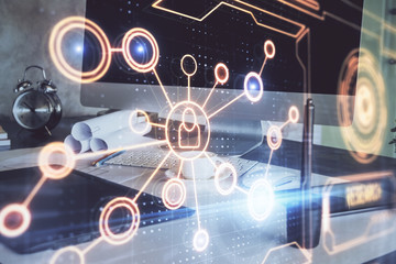 Computer on desktop with social network hologram. Multi exposure. Concept of international people connections.