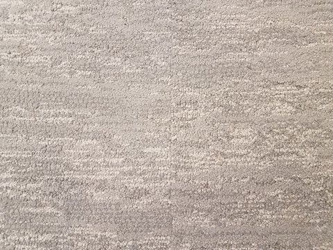 grey carpet or rug or textile on floor or ground