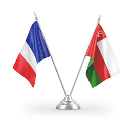 Oman and France table flags isolated on white 3D rendering