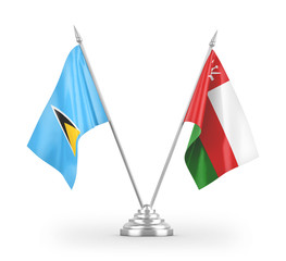 Oman and Saint Lucia table flags isolated on white 3D rendering