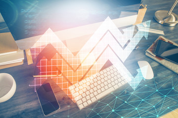 Computer on desktop with point up arrows hologram. Double exposure. Concept of success.