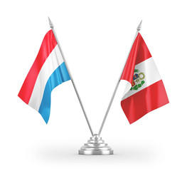 Peru and Luxembourg table flags isolated on white 3D rendering