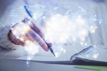 International business hud over woman's hands writing background. Concept of hard work. Double...