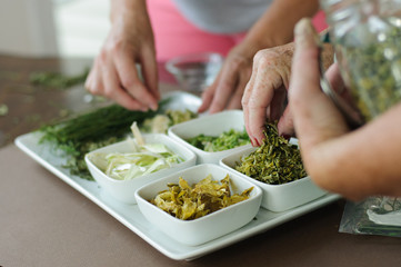 women preparing dehydrated food and spices