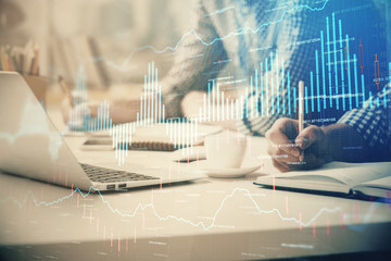 Multi exposure of forex chart with man working on computer on background. Concept of market analysis.