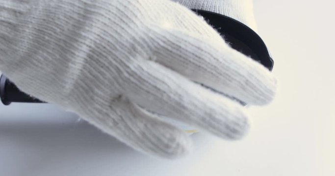 Worker in gloves disc replacement with angle grinder
