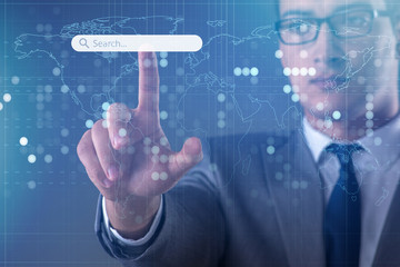 Search concept with businessman pressing button