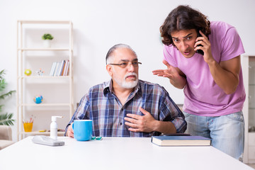 Young student and his old grandpa at home