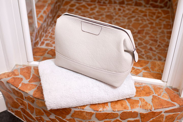 luxury white leather beauty bag with towel in shower room