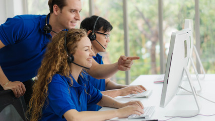 customer service and call center agents are on training by call center supervisor at customer...