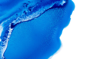 Classic blue and white watercolor paint in abstract flowing shapes for design similar to arctic snow hills and sea with melting glaciers isolated on white background. Unusual stains of paint in macro.