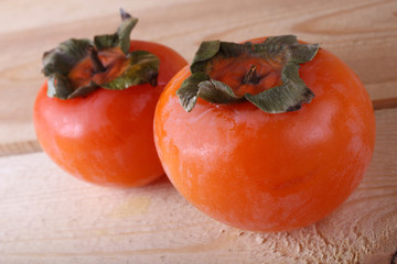 Persimmons on table