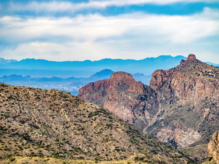 view of distant mountains from top of desert mountain