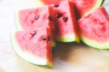 Watermelon slice on wooden background - Close up fresh watermelon tropical fruit
