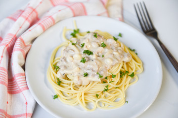 Spaghetti italian pasta served on white plate with parsley in the restaurant italian food and menu concept - Spaghetti carbonara