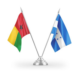 Honduras and Guinea-Bissau table flags isolated on white 3D rendering