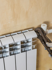 The process of connecting the radiator to the heating system. Accident of the heating system of a...