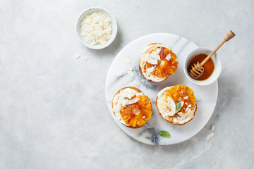 Delicious toast with cream cheese, roasted pineapples, cinnamon and coconut.
