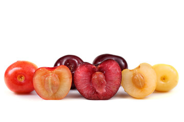 Different color cherries with halves