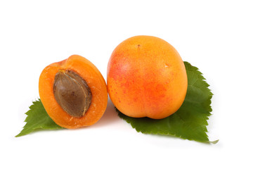 Apricot with a half on leaves