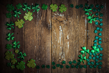 St Patricks Day frame of glittery shamrocks.