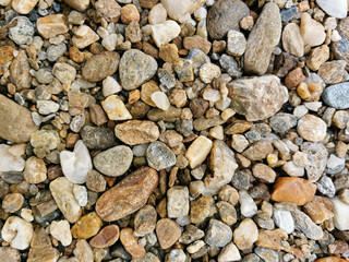 Top view of Pebbles texture background. River stones landscape