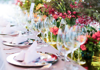 Table setting for a wedding or dinner event, with flowers