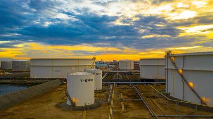 Aerial view oil tanker ship at the port at night, transportation and import export business.