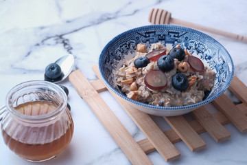 Close up of blue berry on oat in a bowl 