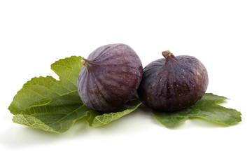 Two figs on leaves
