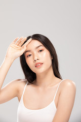 Fototapeta premium Beautiful Asian woman looking at camera smile with clean and fresh skin Happiness and cheerful with positive emotional,isolated on white background,Beauty and Cosmetics Concept