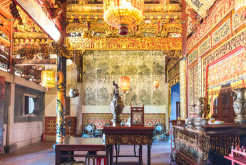 Fototapeta na wymiar The altar inside the Khoo Kongsi, a large Chinese clanhouse with elaborate and highly ornamented architecture and one of the main attractions of Penang