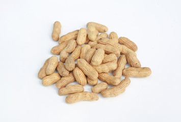 Pile of peanut isolated on white background. Unpeeled nuts.