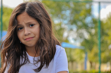 Fototapeta premium coronavirus young girl sick worried scared closeup white tshirt quarantined testing symptoms scared mask sand sick usa dead stomach pain symptoms sick hurt kid death quarantine usa covid19 cuban india