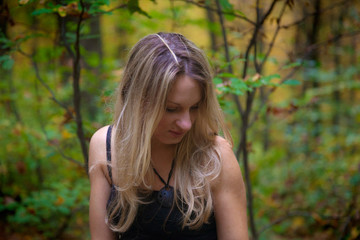 Naklejka premium A girl in autumn forest