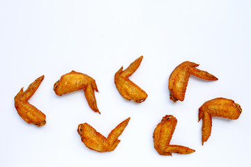 Fried chicken wings on white background.