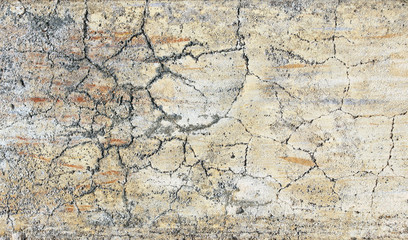 Old stucco wall texture of gray, white and yellow color