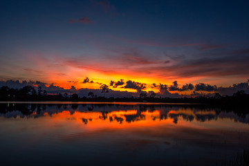 Wallpaper blurred nature of the twilight light in the evening by the large water basin surrounded...