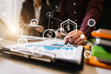 Working team meeting concept, business using laptop and smart phone and digital tablet computer with digital marketing media  in virtual icon network diagram office in morning light