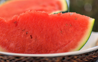 Greece , watermelon from a thessaly plain . superb for the North, but it also grows well in heat and drought. The flesh is red and deliciously sweet. Fruit has a dark rind and weighs 8-12 lbs each.